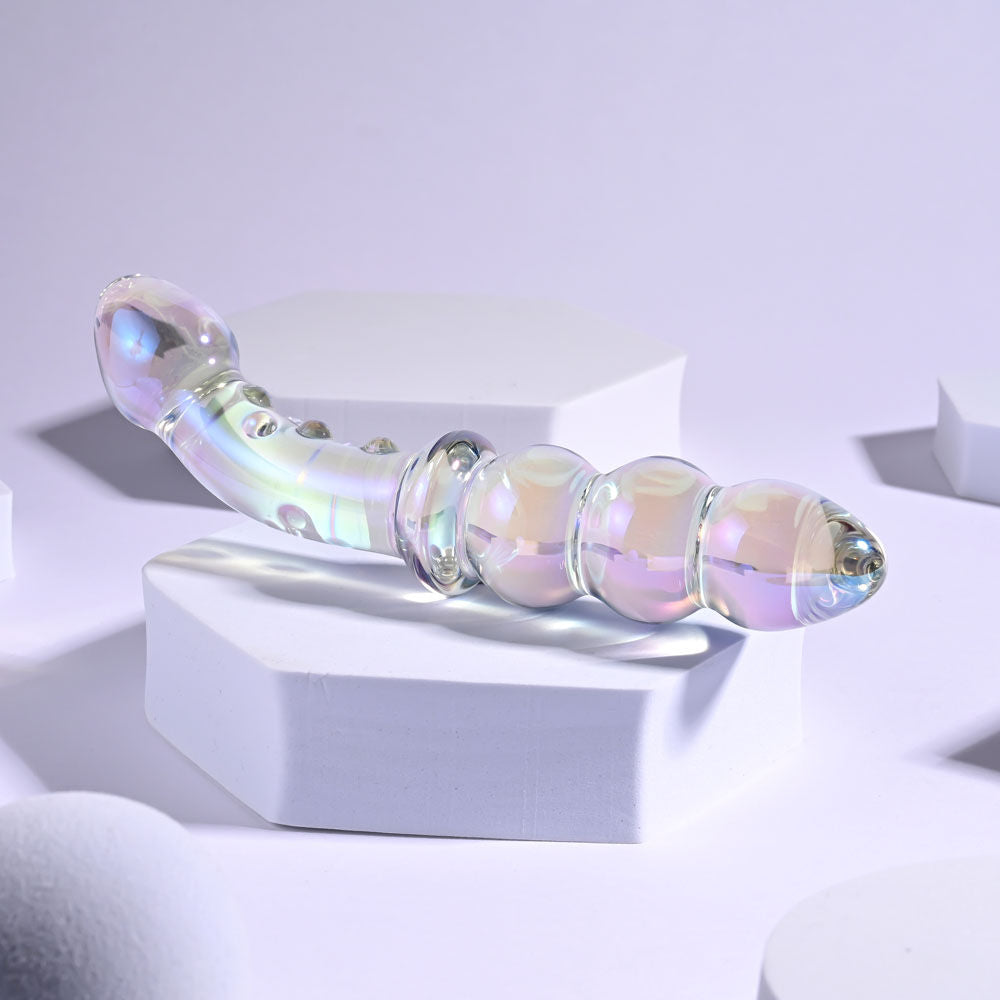 Close-up bottom view focusing on the tip of the borosilicate glass anal beads on a grey light pink background | Flirty Bay, anal plug adult store Australia